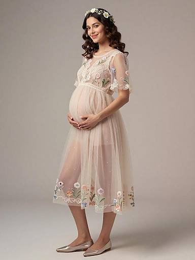 Pregnant Woman in Sheer Floral Maternity Dress