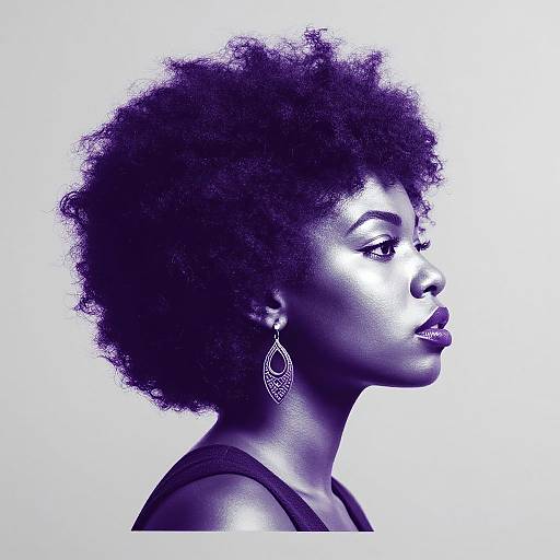 Photographic portrait of a dark-skinned woman with a natural afro, wearing a black top and intricate drop earrings, illuminated in high-contrast blue