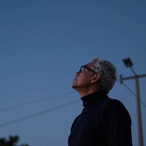 Man Gazing at Shooting Star in Sky