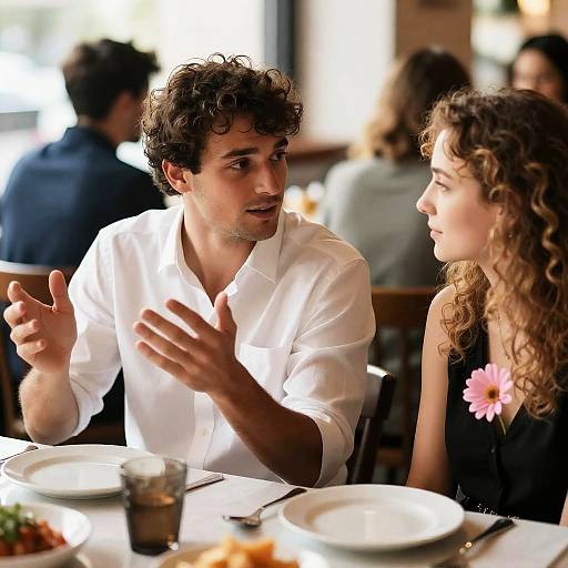 Couple Talking at Restaurant Table