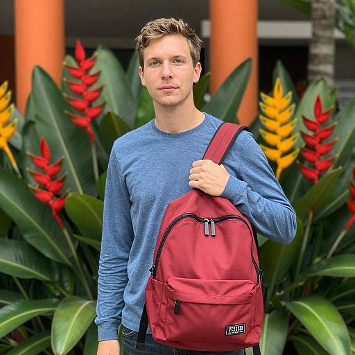 Man with Backpack Among Tropical Plants