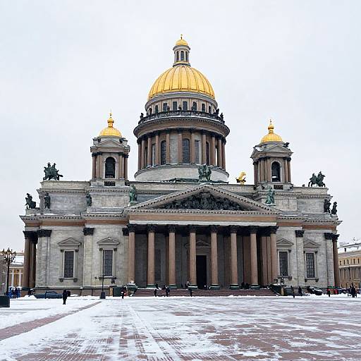 Photograph of a grand, neoclassical church with a gold dome, flanked by smaller domes, and statues on each corner, set