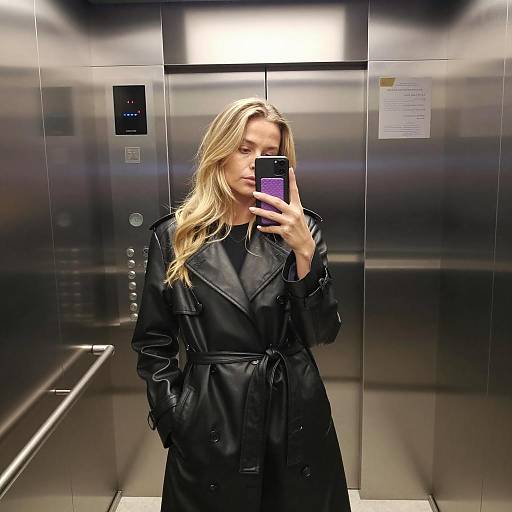Woman Taking Selfie in Elevator