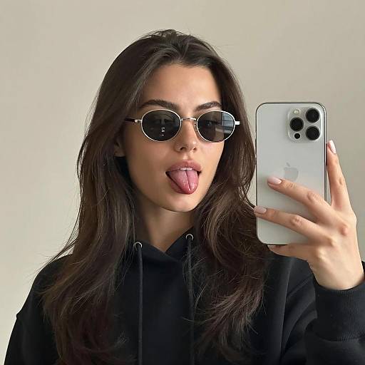 Woman Taking Selfie With Tongue Out