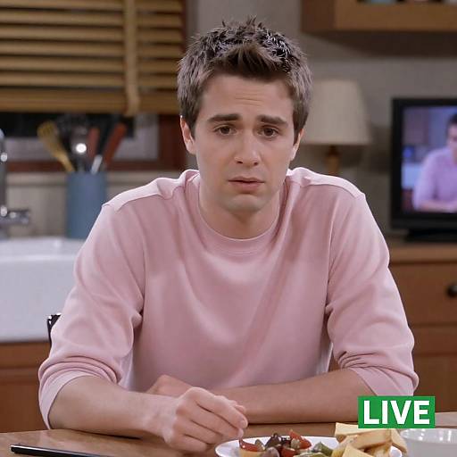 Young Man at Cluttered Kitchen Table