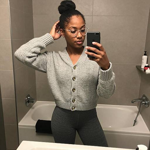 Woman Taking Mirror Selfie in Bathroom