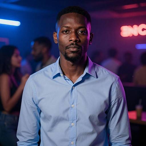 Serious Black Man in Neon Nightclub