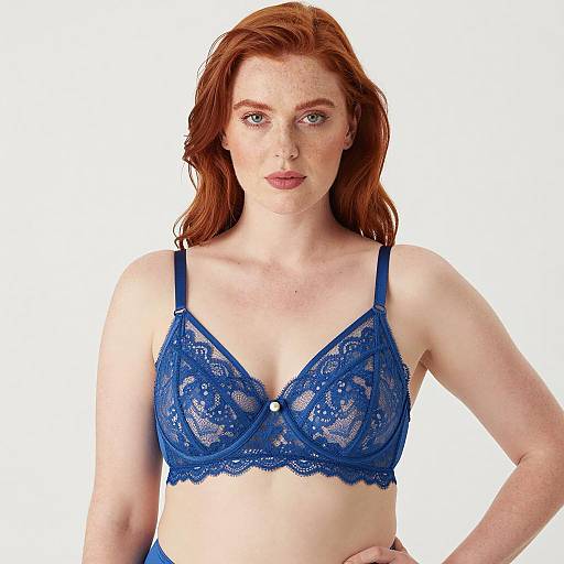 Red-haired woman in blue lace bra