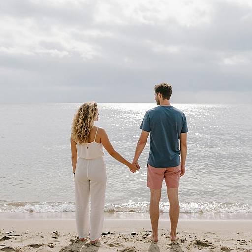 Couple Holding Hands on Beach
