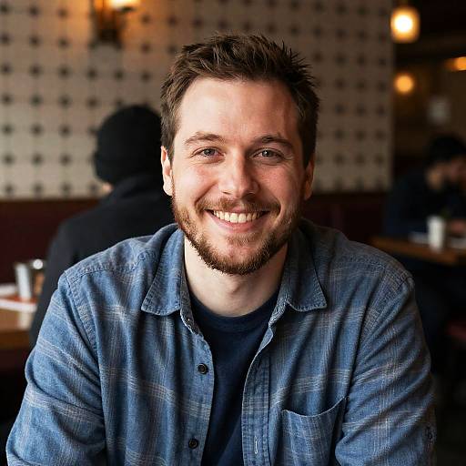 Smiling Man in Cozy Restaurant Setting
