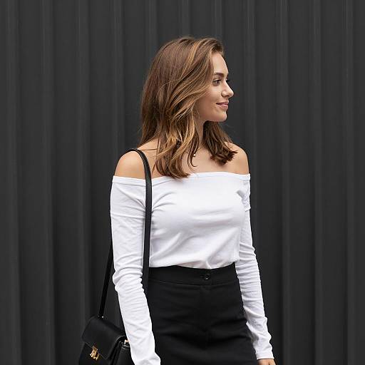 Young woman in off-shoulder top and black skirt