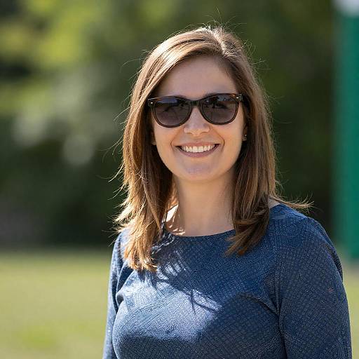 Smiling Woman Wearing Sunglasses Outdoors