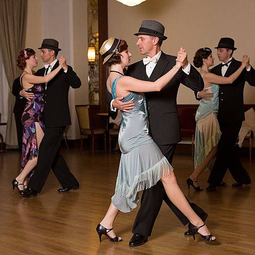 Photograph of a vintage-style dance class, couples in black suits and fringed dresses, top hats, dancing in a warmly lit room.