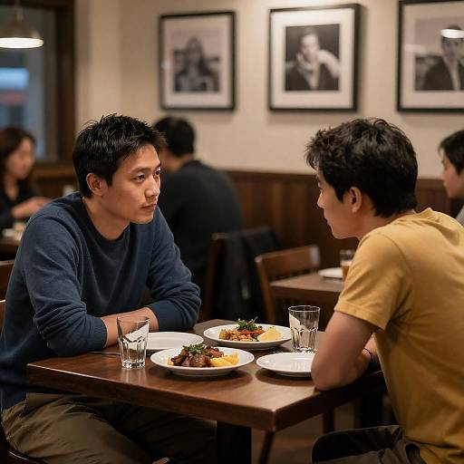 Dimly Lit Restaurant Conversation Between Two Men