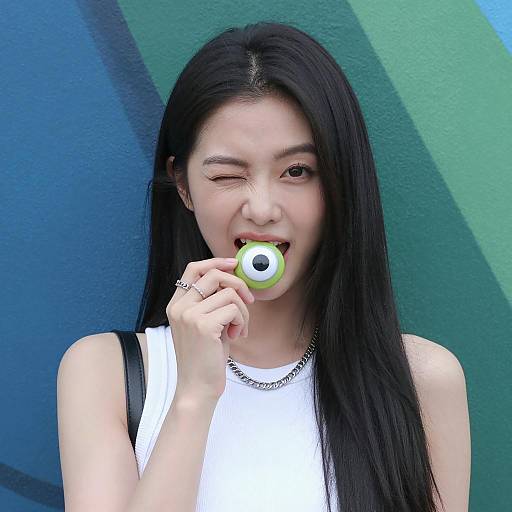 Playful Asian Woman with Googly-Eyed Object