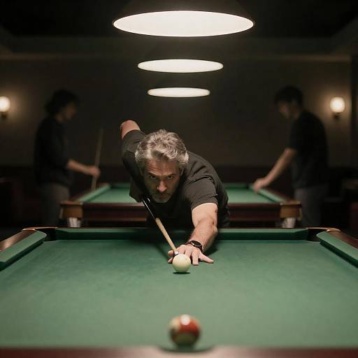 Man Aiming at Pool Table in Dim Light