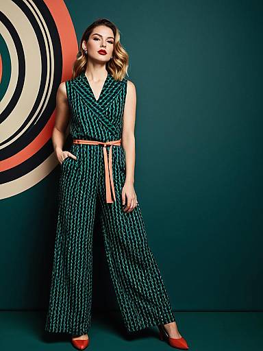 Woman in Stylish Sleeveless Belted Jumpsuit