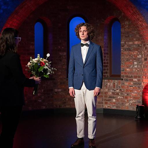 Stylish Duo in a Dimly Lit Room