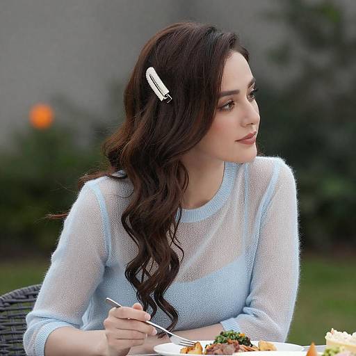 Thoughtful Woman in Sheer Blue Dress