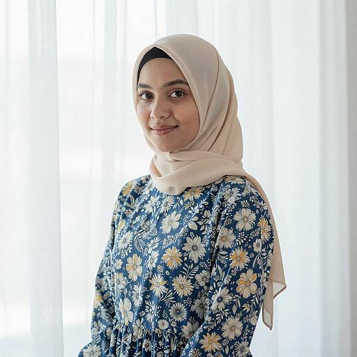 Young Woman in Beige Hijab and Floral Dress