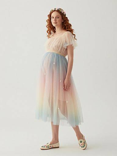 Serene Pregnant Woman in Pastel Fairy Dress