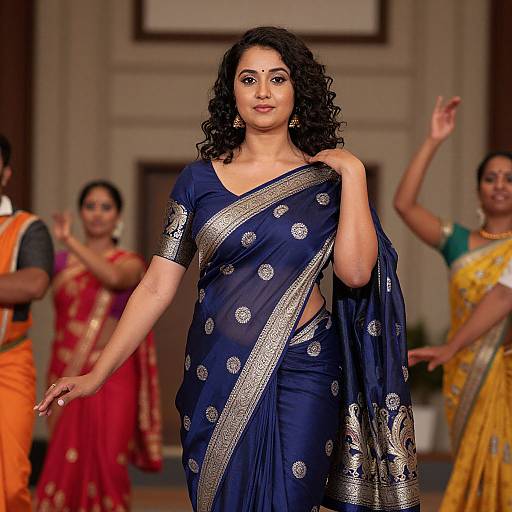 Photograph of a curvy Indian woman with medium skin tone and curly black hair, wearing a navy blue saree with silver embroidery, confidently walking a