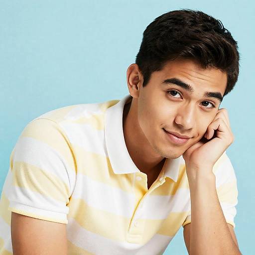Confident Young Man in Striped Polo