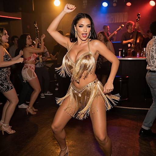 Photograph of a confident Latina woman with long black hair, wearing a gold fringe bikini, dancing energetically on a dimly lit stage with colorful