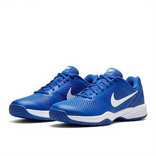 Photograph of vivid blue Nike sneakers with white Nike swoosh, white midsole, and textured mesh fabric, positioned side by side against a white background