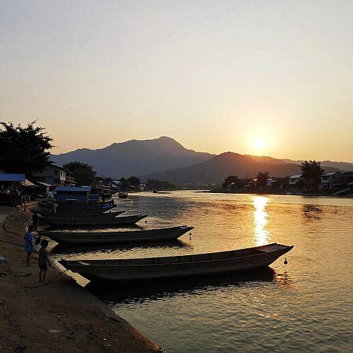Sunset Riverside Village with Boats
