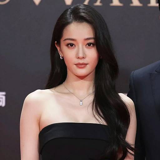 Elegant Asian Woman in Black Strapless Dress