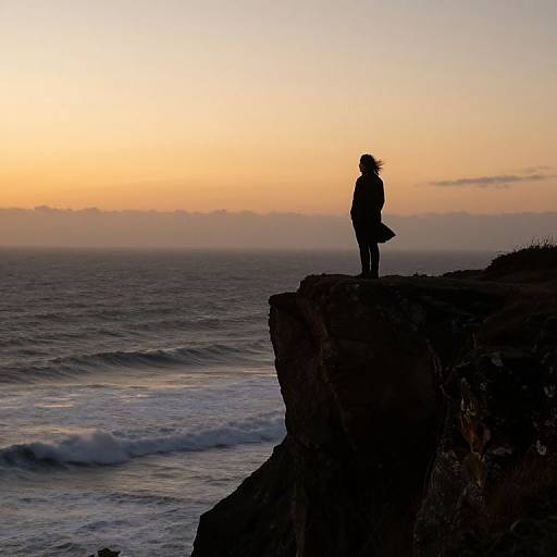 Silent Figure on Cliff at Sunset