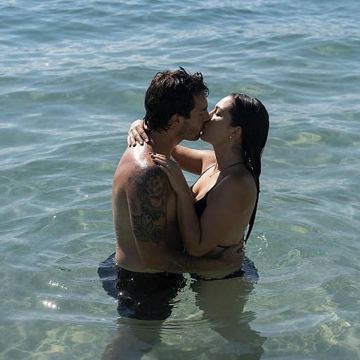 Shimmering Ocean Embrace: Tattooed Couple