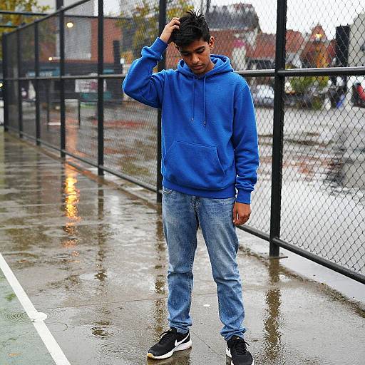 Teenage South Asian Boy by Urban Basketball Court