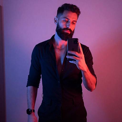 Bearded Man Taking Mirror Selfie with Vibrant Lighting