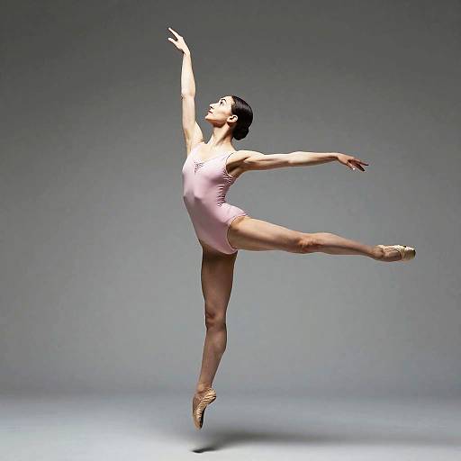 Dancer Mid-Air in Pink Leotard