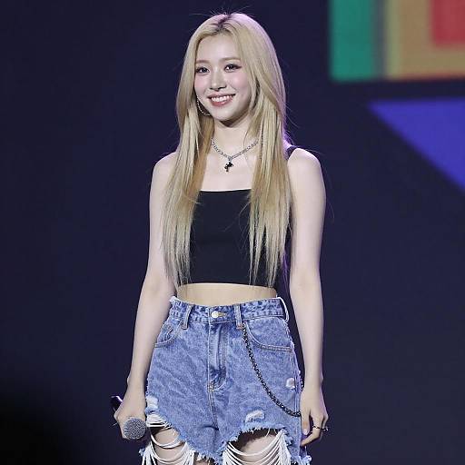 Young Blonde Singer on Colorful Stage