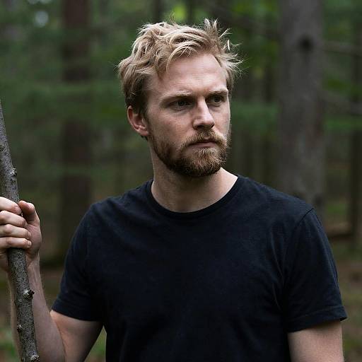 Serious Blond Man in Forest Setting