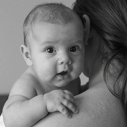 Black and White Baby Portrait on Adult's Shoulder