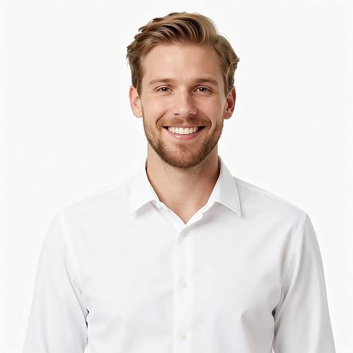 Photograph of a smiling, bearded man with light brown hair, wearing a white dress shirt, against a plain white background.
