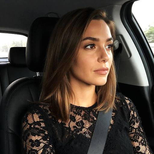 Thoughtful Woman in Dimly Lit Car
