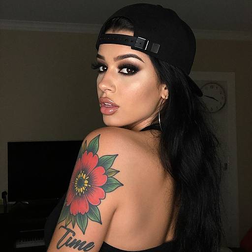 Sultry Woman with Tattoo and Backward Cap