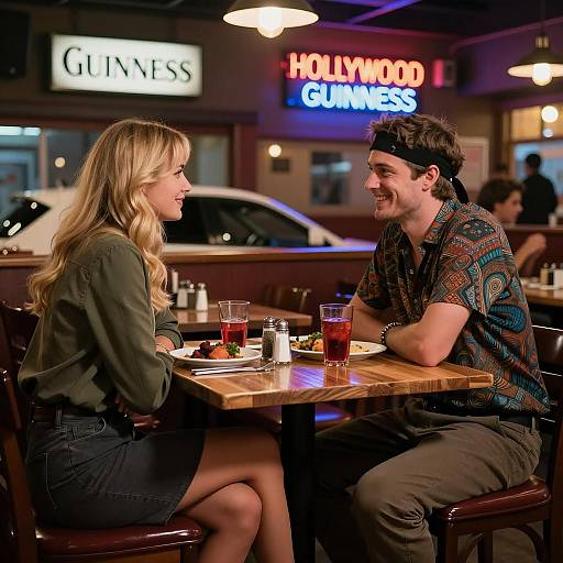 Couple Dining in Cozy Restaurant with Neon Signs