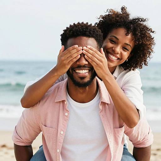 Playful Beach Hug: Smiling Black Couple