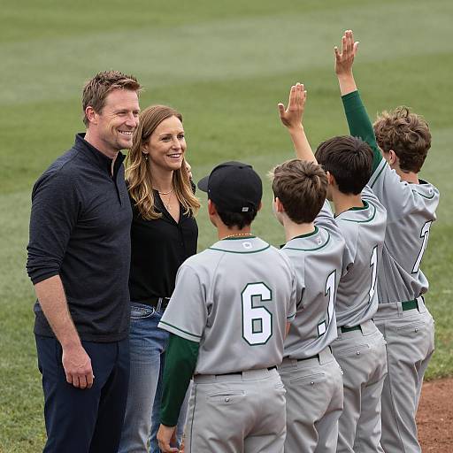Youth Baseball Team Celebrating with Coaches