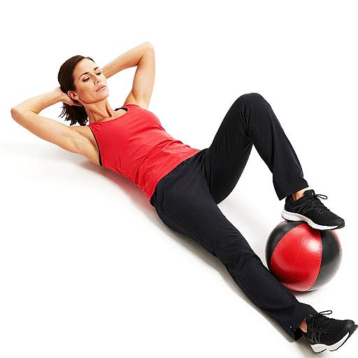 Fit Woman Exercising with Ball
