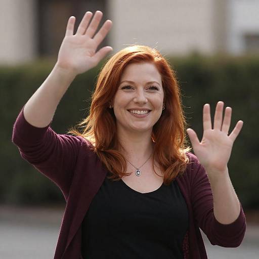 Smiling Woman Waving Both Hands Outdoors