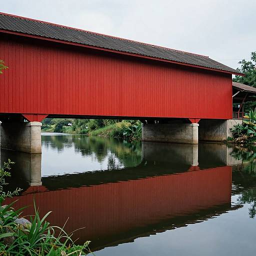 Red Covered Bridge Over Calm River