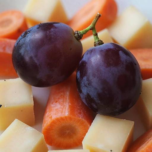 Close-Up of Grapes with Cheese and Carrots