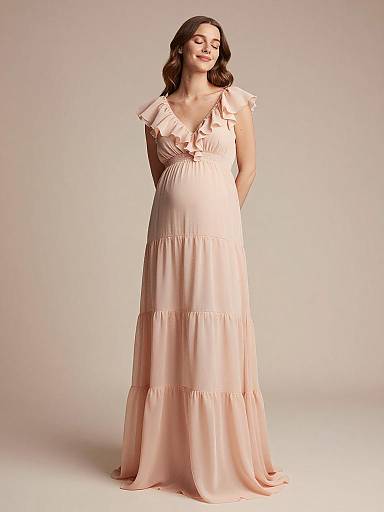 Pregnant Woman in Pale Peach Chiffon Maternity Gown